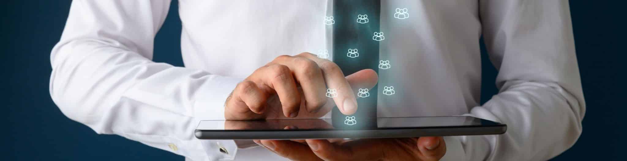 A doctor on tablet learning how his digital presence can build trust with patients.